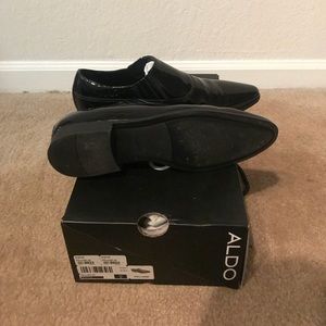 ALDO Black patent leather slip ons